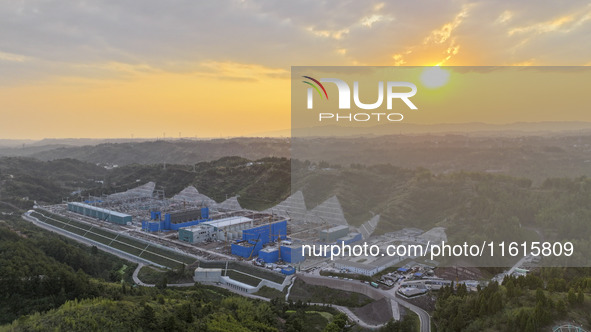 Construction workers work at the construction site of the 800 kV Yubei converter station in Chongqing, China, on September 28, 2024. 