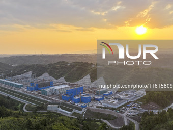 Construction workers work at the construction site of the 800 kV Yubei converter station in Chongqing, China, on September 28, 2024. (