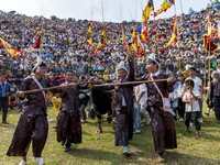 People watch a bullfight at the Songxue bullfight pond in Congjiang county, Southwest China's Guizhou province, on September 28, 2024. (