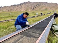 Staff members check the safety operation of the gondola at the Qilian Mountain ski resort in Zhangye, China, on September 28, 2024. (