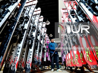 Staff members repair skis at the Qilian Mountain ski resort in Zhangye, China, on September 28, 2024. (