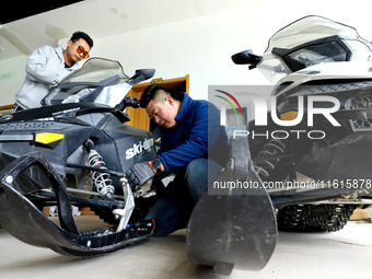 A snowmobile is repaired at the Qilian Mountain ski resort in Zhangye, China, on September 28, 2024. (