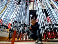 Staff members repair ski poles at the Qilian Mountain ski resort in Zhangye, China, on September 28, 2024. (