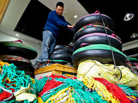 A staff member repairs a ski ring at the Qilian Mountain ski resort in Zhangye, China, on September 28, 2024. (