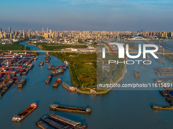 A photo taken on September 28, 2024, shows water transport along the Beijing-Hangzhou Grand Canal in Huai'an, Jiangsu province, China. (