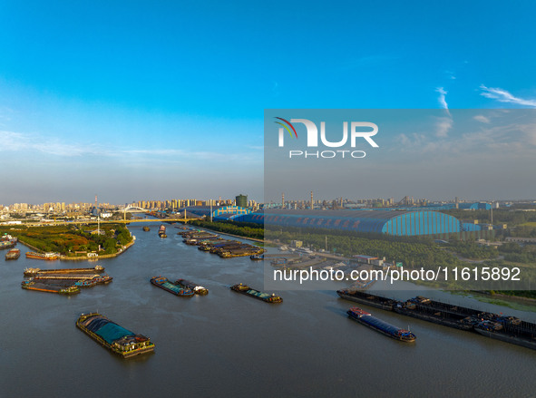 A photo taken on September 28, 2024, shows water transport along the Beijing-Hangzhou Grand Canal in Huai'an, Jiangsu province, China. 