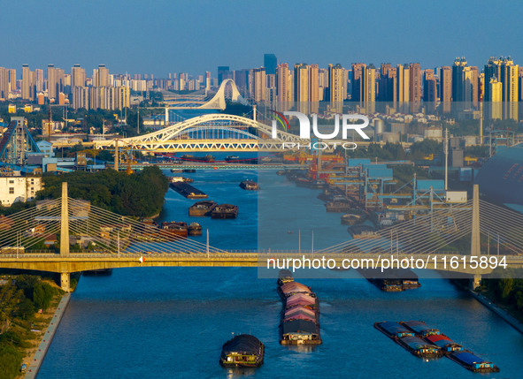 A photo taken on September 28, 2024, shows water transport along the Beijing-Hangzhou Grand Canal in Huai'an, Jiangsu province, China. 