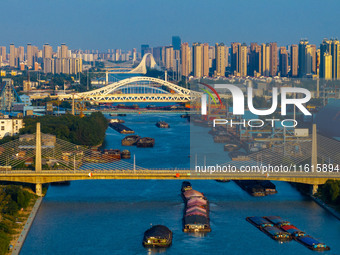 A photo taken on September 28, 2024, shows water transport along the Beijing-Hangzhou Grand Canal in Huai'an, Jiangsu province, China. (