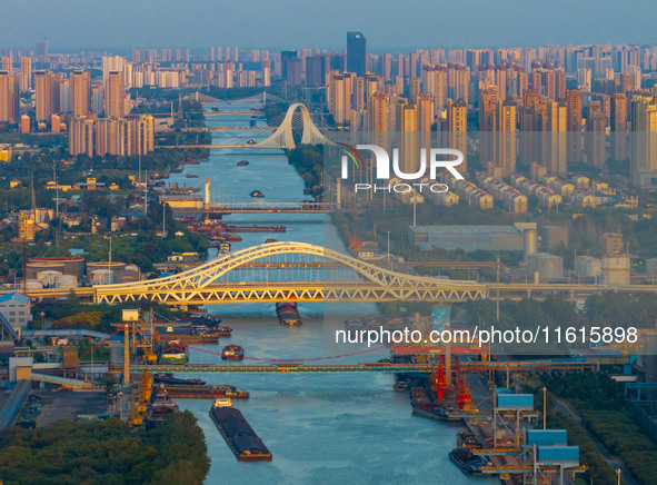 A photo taken on September 28, 2024, shows water transport along the Beijing-Hangzhou Grand Canal in Huai'an, Jiangsu province, China. 