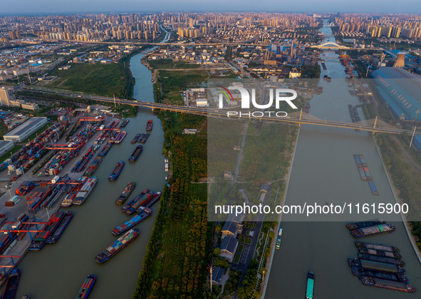 A photo taken on September 28, 2024, shows water transport along the Beijing-Hangzhou Grand Canal in Huai'an, Jiangsu province, China. 