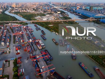 A photo taken on September 28, 2024, shows water transport along the Beijing-Hangzhou Grand Canal in Huai'an, Jiangsu province, China. (