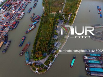 A photo taken on September 28, 2024, shows water transport along the Beijing-Hangzhou Grand Canal in Huai'an, Jiangsu province, China. (