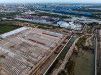 Workers work at the construction site of the third phase of the Canal New Port operation zone in Huai'an, China, on September 28, 2024. (