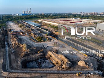 Workers work at the construction site of the third phase of the Canal New Port operation zone in Huai'an, China, on September 28, 2024. (