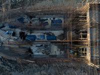 Workers work at the construction site of the third phase of the Canal New Port operation zone in Huai'an, China, on September 28, 2024. (