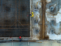 Workers work at the construction site of the third phase of the Canal New Port operation zone in Huai'an, China, on September 28, 2024. (