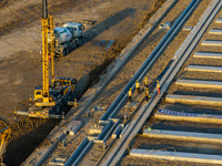 Workers work at the construction site of the third phase of the Canal New Port operation zone in Huai'an, China, on September 28, 2024. (