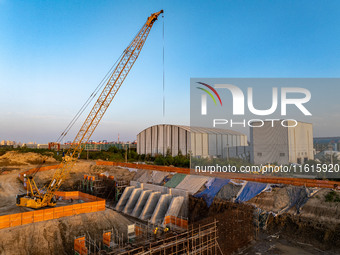 Workers work at the construction site of the third phase of the Canal New Port operation zone in Huai'an, China, on September 28, 2024. (