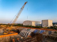 Workers work at the construction site of the third phase of the Canal New Port operation zone in Huai'an, China, on September 28, 2024. (