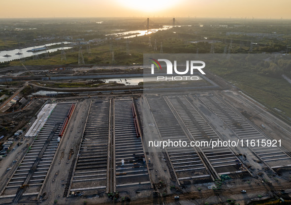 Workers work at the construction site of the third phase of the Canal New Port operation zone in Huai'an, China, on September 28, 2024. 