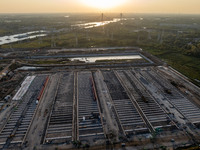 Workers work at the construction site of the third phase of the Canal New Port operation zone in Huai'an, China, on September 28, 2024. (