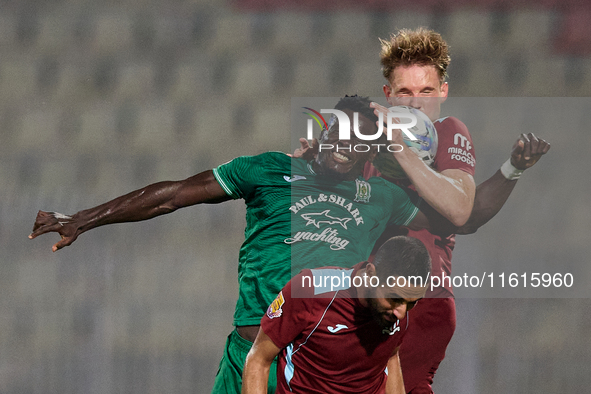 Franklin Sasere of Floriana vies for the ball with Gabriel Bohrer Mentz of Gzira United during the Malta 360 Sports Premier League soccer ma...