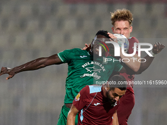 Franklin Sasere of Floriana vies for the ball with Gabriel Bohrer Mentz of Gzira United during the Malta 360 Sports Premier League soccer ma...