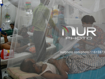 Patients receive medical treatment as they suffer from dengue at a hospital in Dhaka, Bangladesh, on September 28, 2024. (