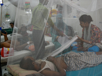 Patients receive medical treatment as they suffer from dengue at a hospital in Dhaka, Bangladesh, on September 28, 2024. (