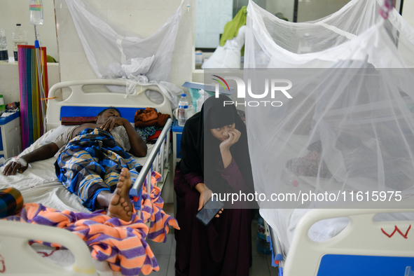 Patients receive medical treatment as they suffer from dengue at a hospital in Dhaka, Bangladesh, on September 28, 2024. 