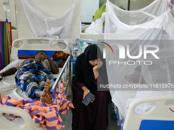 Patients receive medical treatment as they suffer from dengue at a hospital in Dhaka, Bangladesh, on September 28, 2024. (