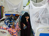 Patients receive medical treatment as they suffer from dengue at a hospital in Dhaka, Bangladesh, on September 28, 2024. (