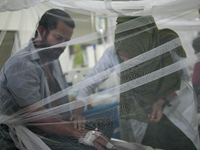 Patients receive medical treatment as they suffer from dengue at a hospital in Dhaka, Bangladesh, on September 28, 2024. (