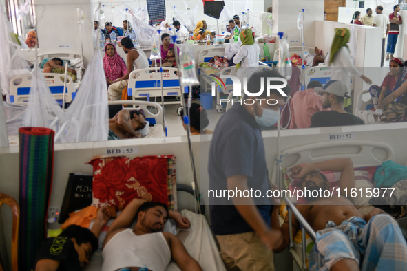 Patients receive medical treatment as they suffer from dengue at a hospital in Dhaka, Bangladesh, on September 28, 2024. 