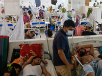 Patients receive medical treatment as they suffer from dengue at a hospital in Dhaka, Bangladesh, on September 28, 2024. (