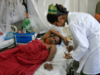 Patients receive medical treatment as they suffer from dengue at a hospital in Dhaka, Bangladesh, on September 28, 2024. (