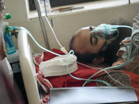 Patients receive medical treatment as they suffer from dengue at a hospital in Dhaka, Bangladesh, on September 28, 2024. (