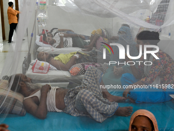 Patients receive medical treatment as they suffer from dengue at a hospital in Dhaka, Bangladesh, on September 28, 2024. (