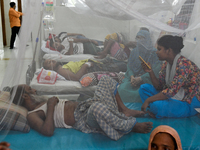 Patients receive medical treatment as they suffer from dengue at a hospital in Dhaka, Bangladesh, on September 28, 2024. (