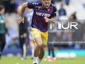 Joel Ward #2 of Crystal Palace F.C. warms up during the Premier League match between Everton and Crystal Palace at Goodison Park in Liverpoo...