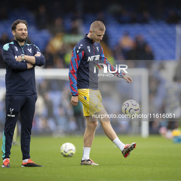 Adam Wharton #20 of Crystal Palace F.C. warms up during the Premier League match between Everton and Crystal Palace at Goodison Park in Live...