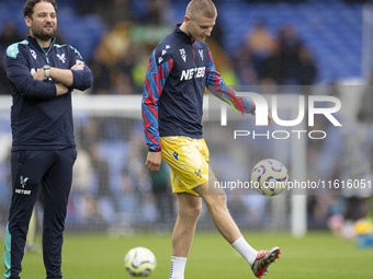 Adam Wharton #20 of Crystal Palace F.C. warms up during the Premier League match between Everton and Crystal Palace at Goodison Park in Live...