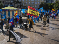 A young man holds a Spanish flag reading ''Long live the unity of Spain'' during a demonstration organized by the Alfonso I Association unde...