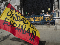 A Spanish flag with the words ''Long live the unity of Spain'' is waved by a supporter during the reading of the manifesto at the demonstrat...