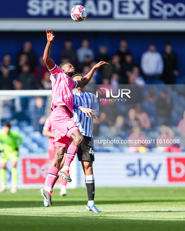 #17, Ousmane Diakite of WBA, and #44, Shea Charles of Sheffield Wednesday, battle in the air during the Sky Bet Championship match between S...