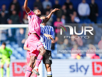 #17, Ousmane Diakite of WBA, and #44, Shea Charles of Sheffield Wednesday, battle in the air during the Sky Bet Championship match between S...