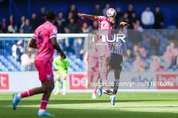 #17, Ousmane Diakite of WBA, and #44, Shea Charles of Sheffield Wednesday, battle in the air during the Sky Bet Championship match between S...