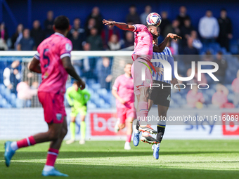 #17, Ousmane Diakite of WBA, and #44, Shea Charles of Sheffield Wednesday, battle in the air during the Sky Bet Championship match between S...