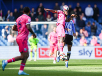 #17, Ousmane Diakite of WBA, and #44, Shea Charles of Sheffield Wednesday, battle in the air during the Sky Bet Championship match between S...