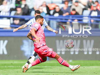 Darnell Furlong of WBA attempts to intercept the shot from Marvin Johnson of Sheffield Wednesday during the Sky Bet Championship match betwe...